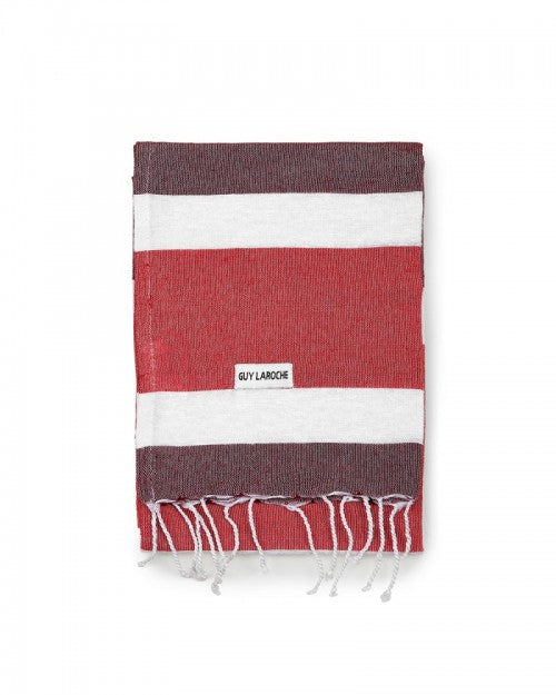 Telo mare Guy Laroche per Essere Bio a righe rosse e bordeaux in cotone, piegato su fondo bianco
